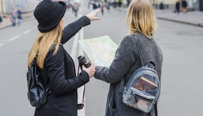 female-tourists-with-map